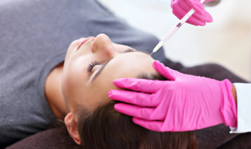 Young woman getting Botox services for forehead wrinkles at InjectCo's med in woodland.