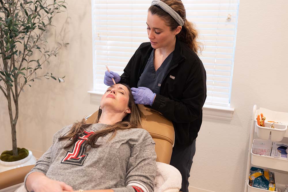 Nurse injector performing Botox near Euless TX at InjectCo MedSpa Colleyville